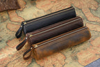 Brown leather pen roll with zip pull tab