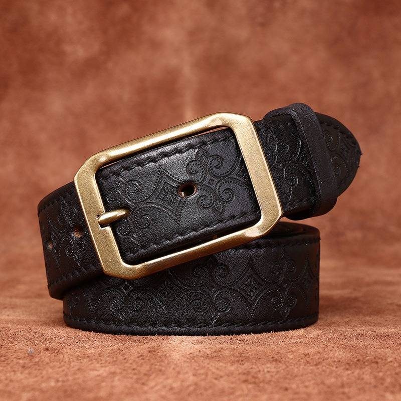 Black men's embossed leather belt — flat lay