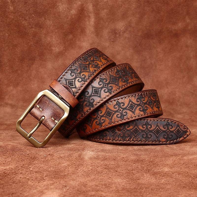 Brown men's embossed leather belt — flat lay