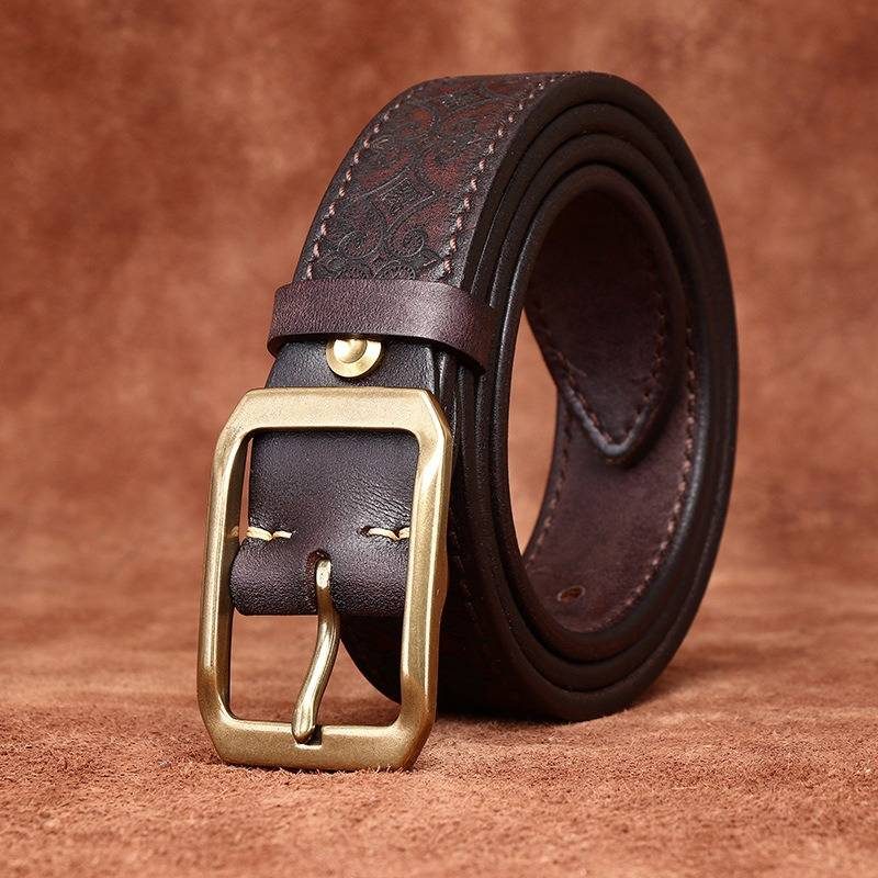 Dark brown men's embossed leather belt — buckle detail
