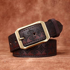 Dark brown men's embossed leather belt — flat lay