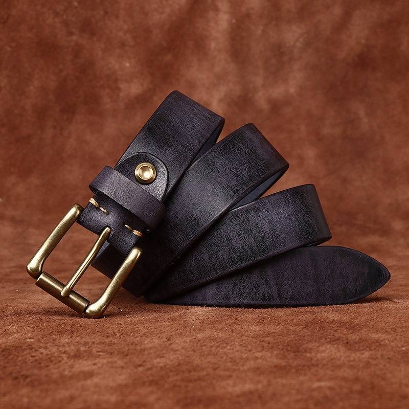 Black men's jeans leather belt — flat lay