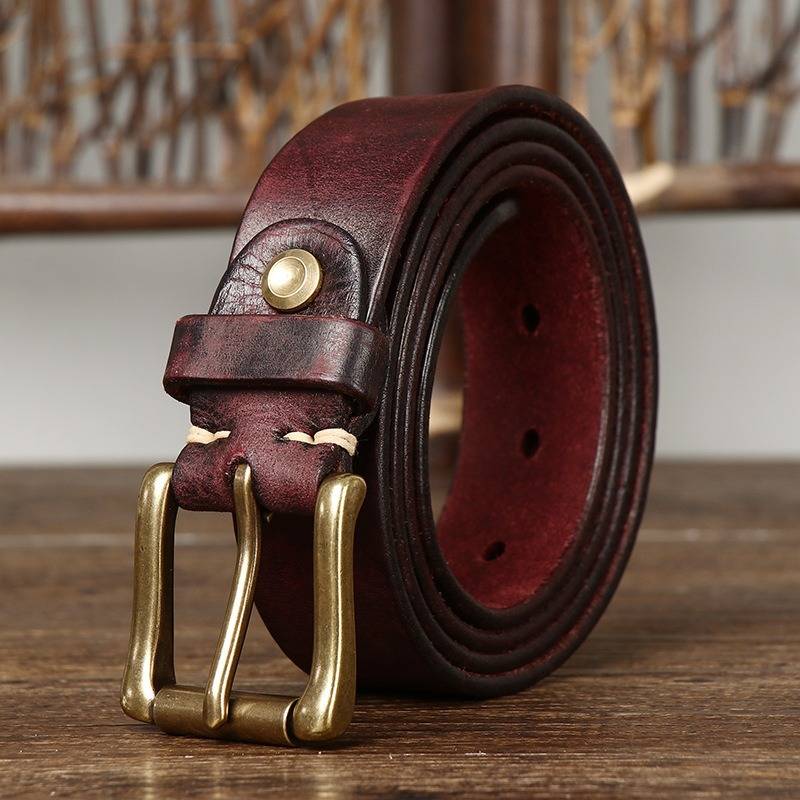 Red men's jeans leather belt — studio shot