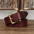 Red men's jeans leather belt — buckle detail