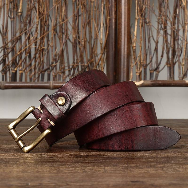 Red men's jeans leather belt — flat lay