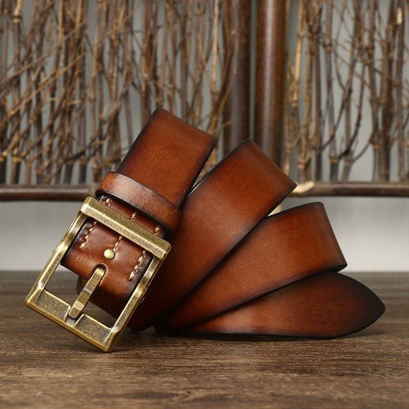 Brown men's heavy duty leather belt — buckle detail