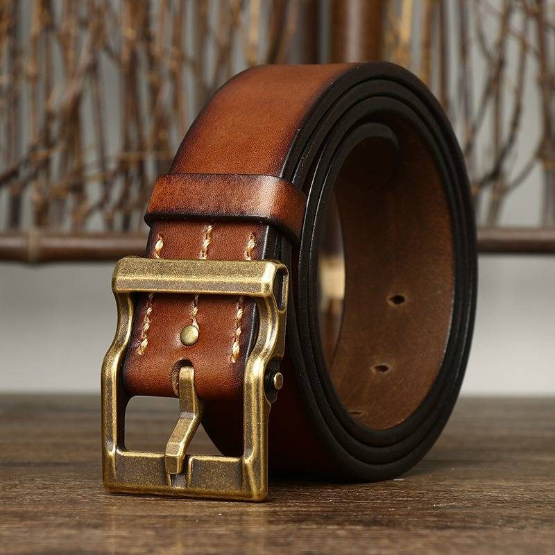Brown men's heavy duty leather belt — flat lay
