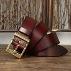 Red men's heavy duty leather belt — flat lay