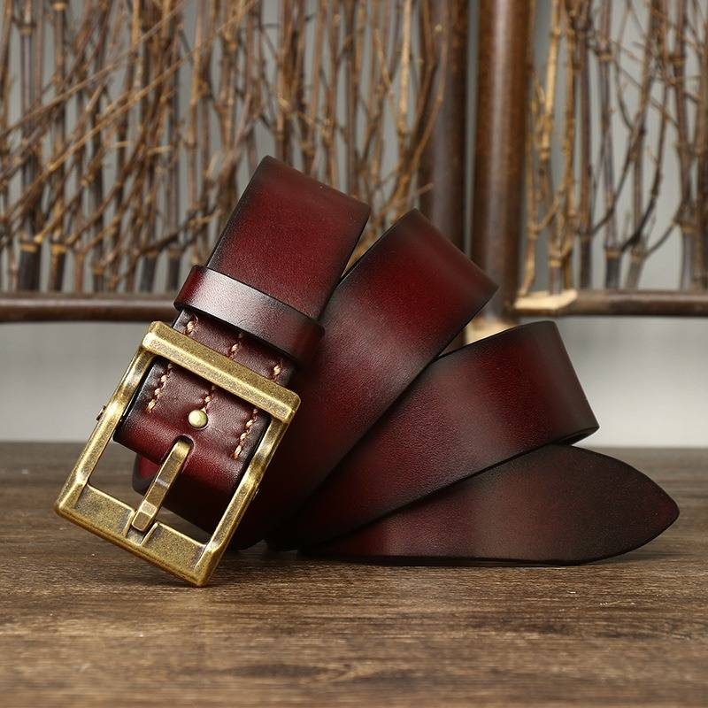 Red men's heavy duty leather belt — flat lay