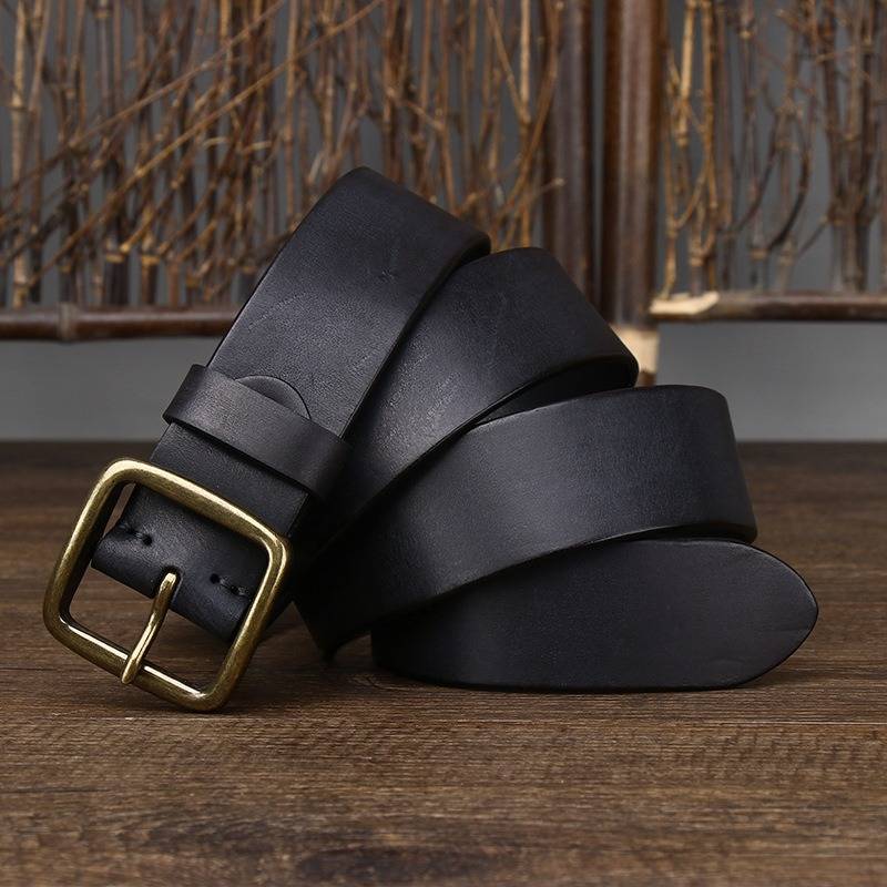 Black men's jeans leather belt — flat lay