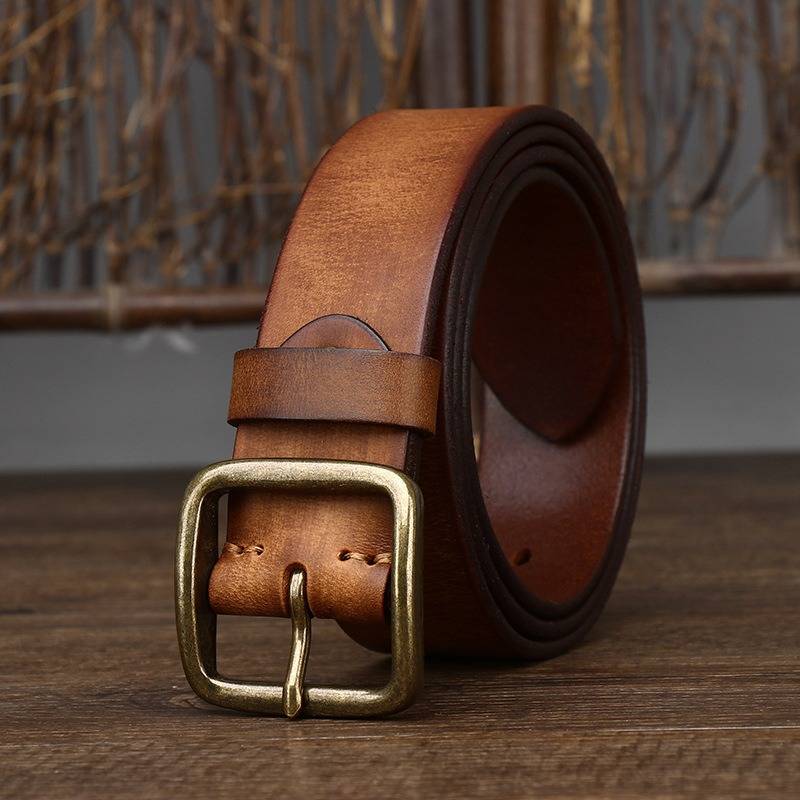 Brown men's jeans leather belt — flat lay