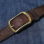 Dark brown men's jeans belt worn with denim