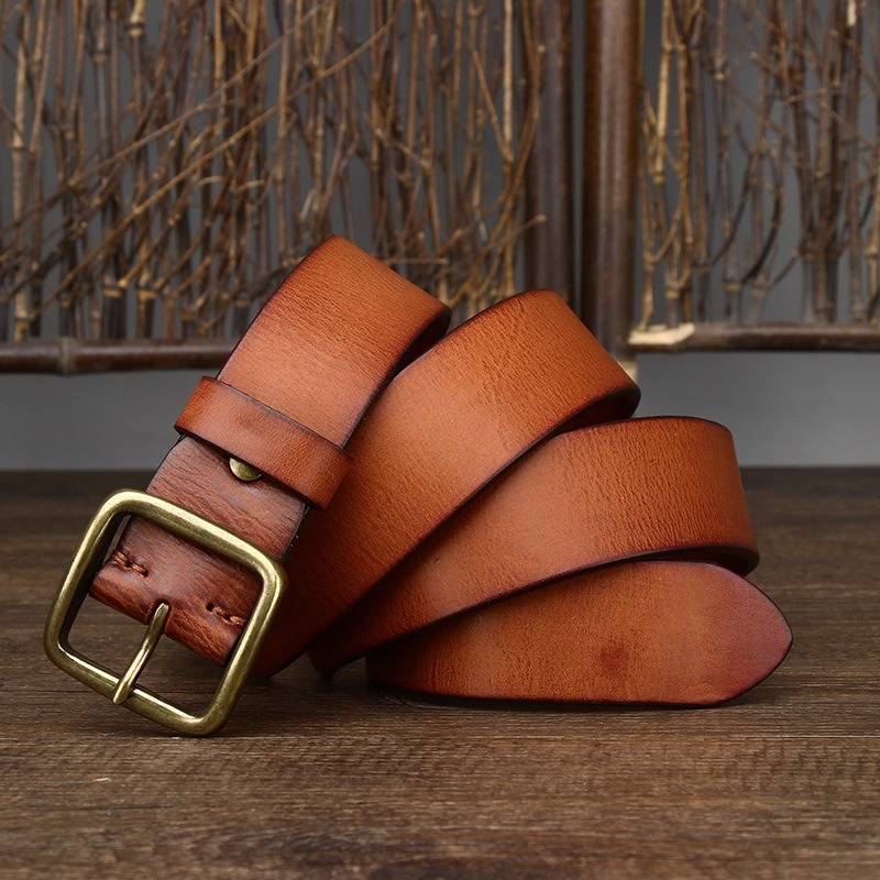 Orange-yellow men's jeans leather belt — flat lay