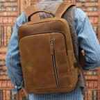 Brown men's leather backpack, strap detail
