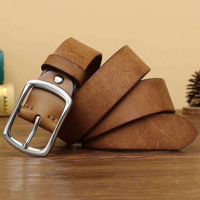 Brown men's leather belt worn with jeans