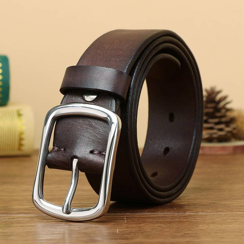 Stainless steel buckle close-up on dark brown men's leather belt