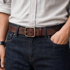 Dark brown full-grain men's leather belt worn with jeans