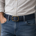 Navy blue full-grain leather belt worn with jeans
