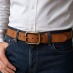 Yellow brown full-grain men's leather belt worn with jeans