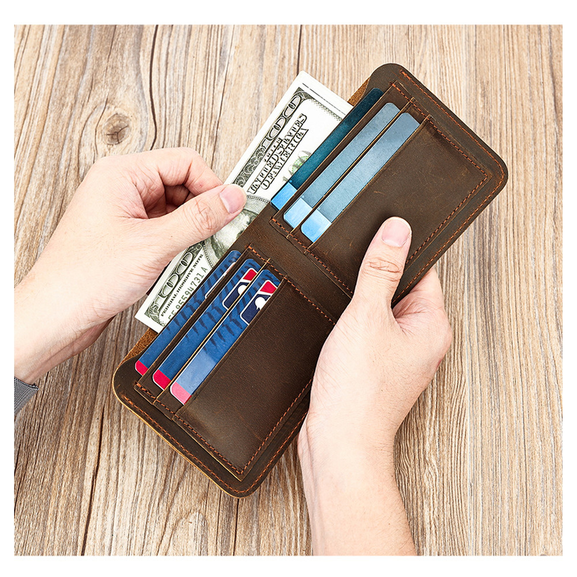 Man holding a dark brown men's wallet with cash