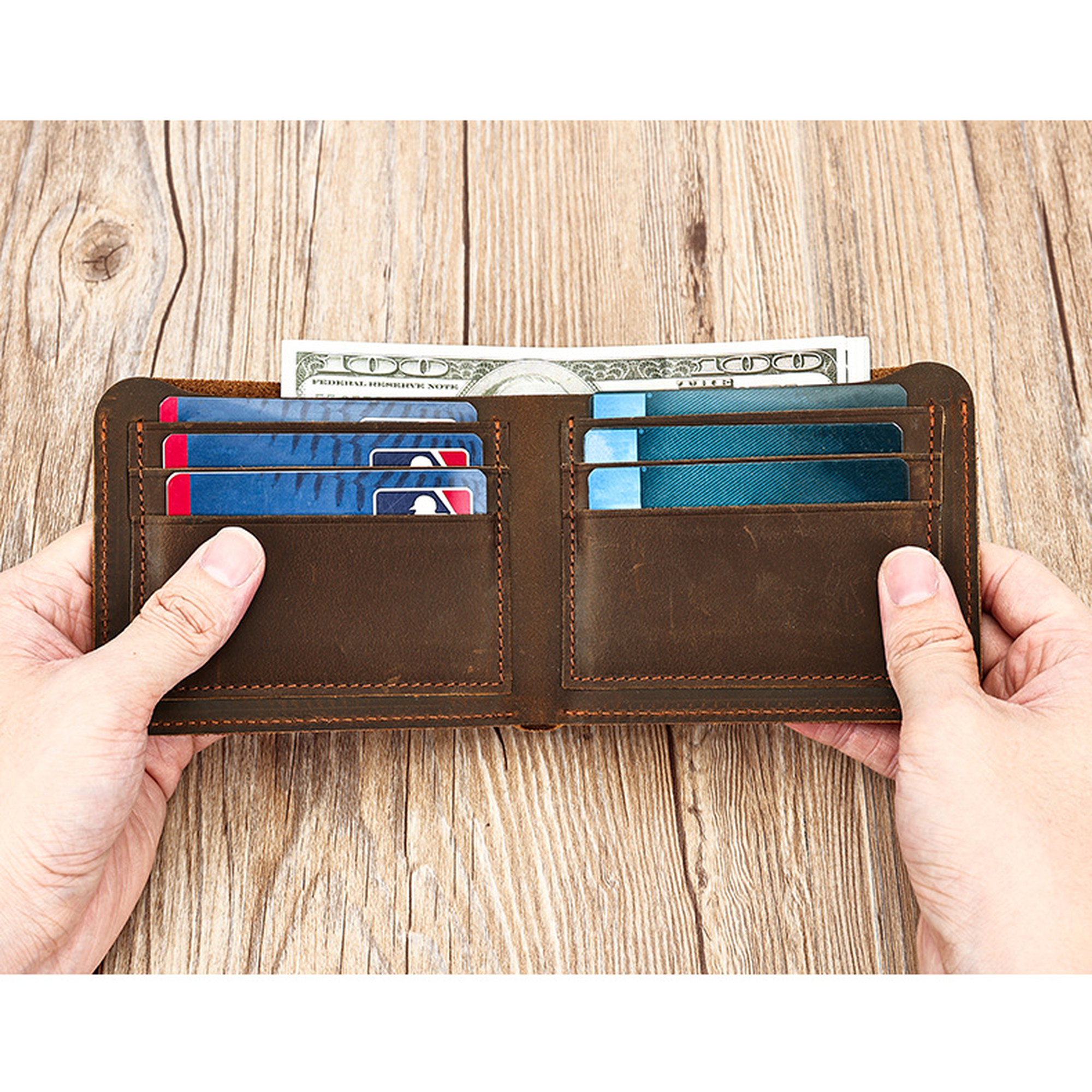Dark brown men's wallet, open with cash and cards