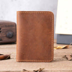 Man holding the brown minimalist bifold wallet