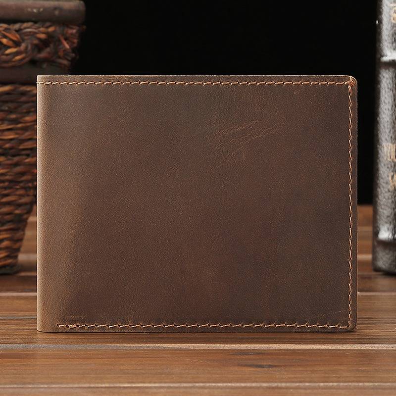 Dark brown men's wallet, flat lay