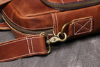 Brown men's briefcase, top handle detail