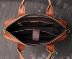Brown men's briefcase, front pocket detail