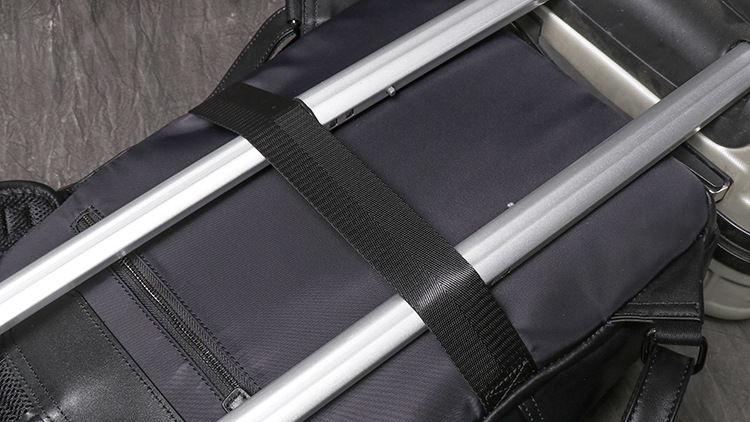 Black men's business backpack, luggage strap detail