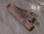 Dark brown men's carry-on bag, handle detail