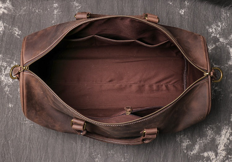 Dark brown men's carry-on bag, strap detail