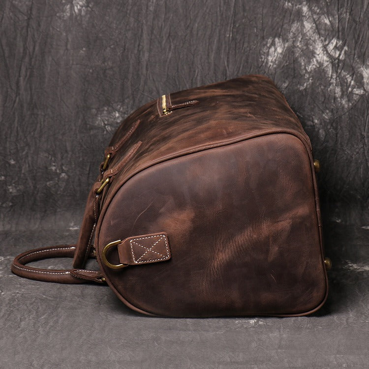 Dark brown men's carry-on bag, flat lay