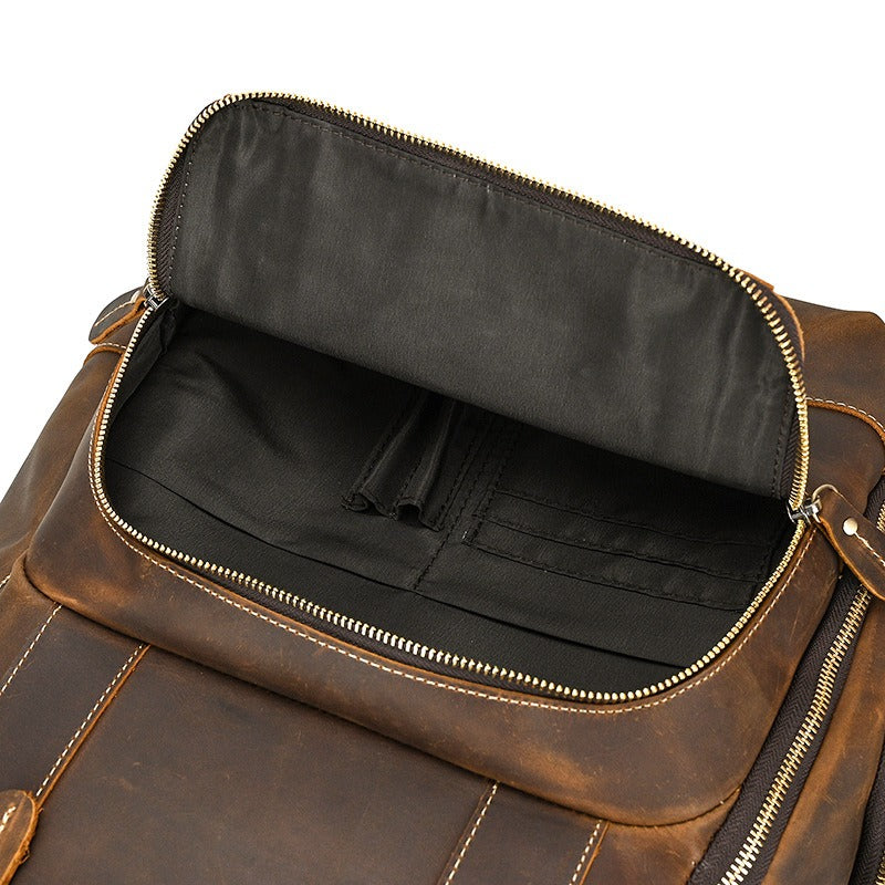 Brown men's college backpack, laptop sleeve detail