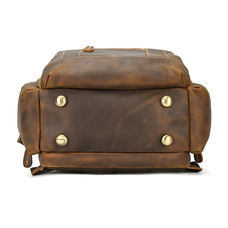 Brown men's college backpack, zip pocket detail