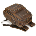 Brown men's college backpack, handle detail