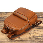 Brown men's computer backpack, laptop sleeve detail