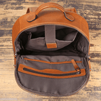 Brown men's computer backpack, front pocket detail