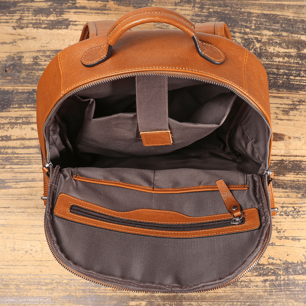 Brown men's computer backpack, front pocket detail