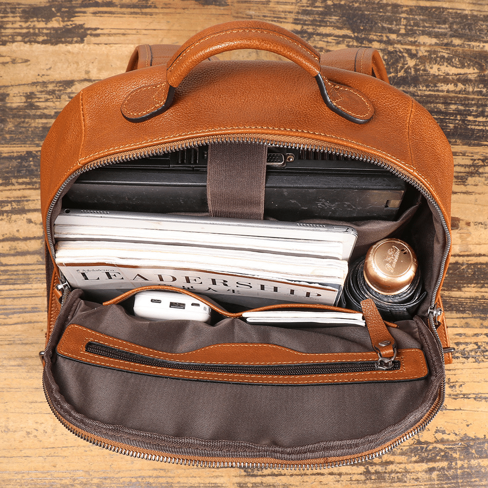 Brown men's computer backpack, handle detail