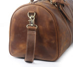 Vintage brown men's duffle bag, side view