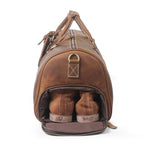 Vintage brown men's duffle bag, shoe compartment detail