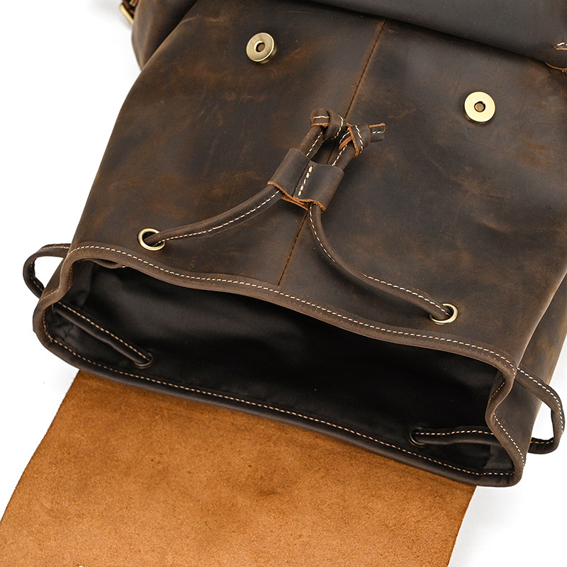 Dark brown men's leather knapsack, laptop sleeve detail