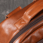 Brown men's laptop backpack, leather grain