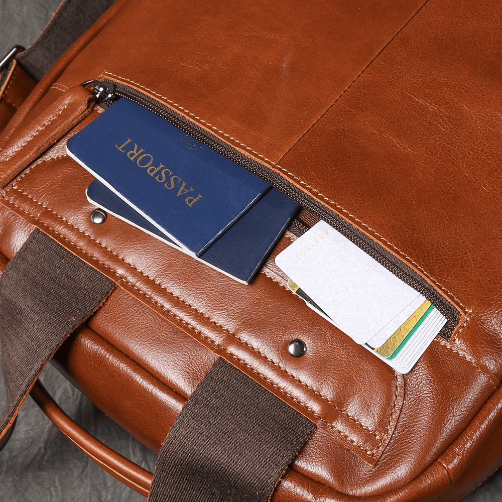 Brown men's laptop backpack, top handle detail