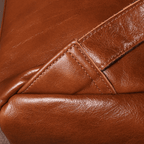 Brown men's laptop backpack, side view