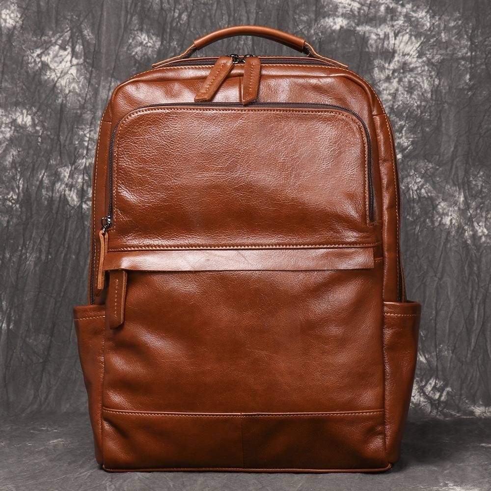 Brown men's laptop backpack, side pocket detail