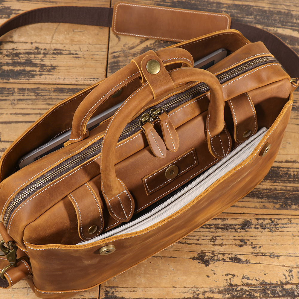 Brown men's laptop case, front pocket detail