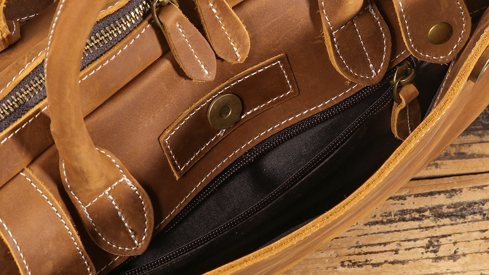 Brown men's laptop case, handle detail