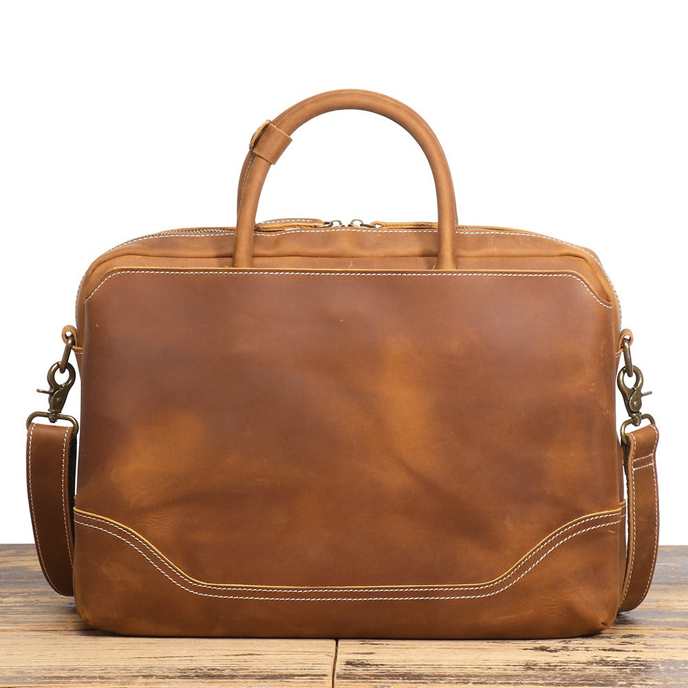 Brown men's laptop case, back pocket detail